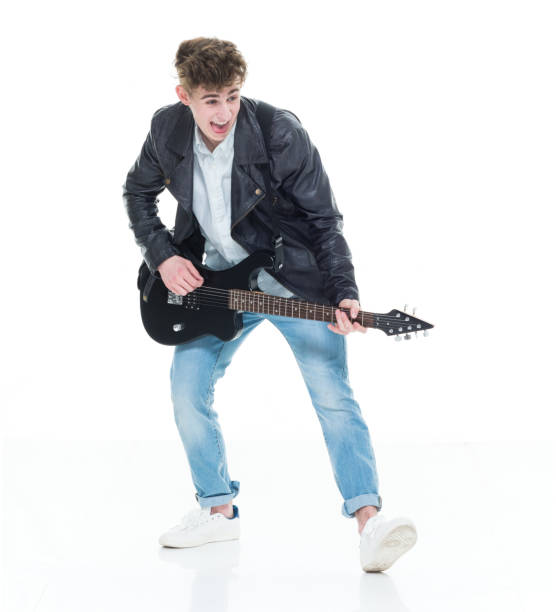 istock Handsome young male playing an electric guitar 924632028