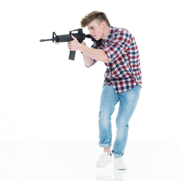 istock Teenager with assault rifle 924632862