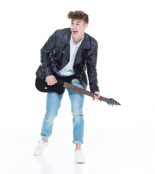 istock Handsome young male playing an electric guitar 924632916
