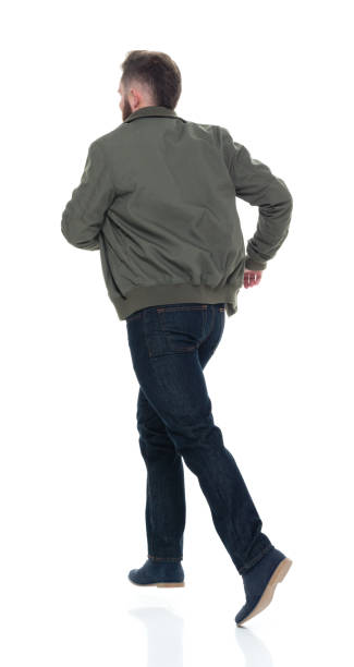 istock Man in bomber jacket and plaid shirt running 924635346
