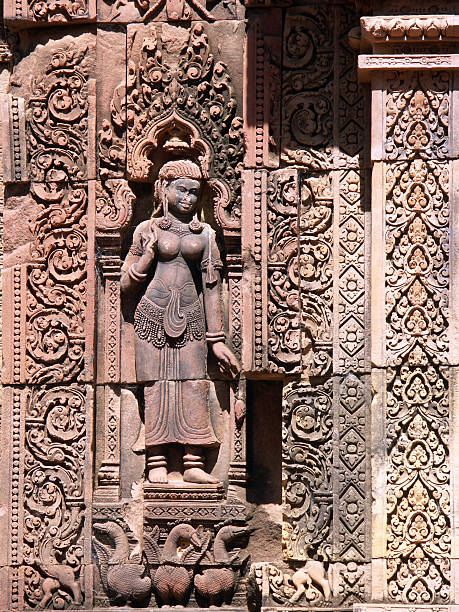 Engraving of a devata on the Banteay Srei Temple wall stock photo