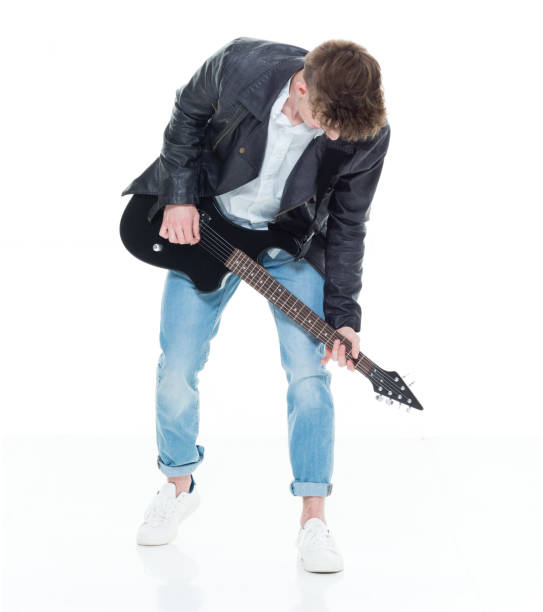 istock Handsome young male playing an electric guitar 924636092