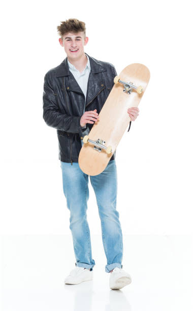istock Handsome young teenager holding a skateboard 924636592