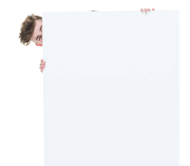 istock Trendy young male holding a white sign 924636604
