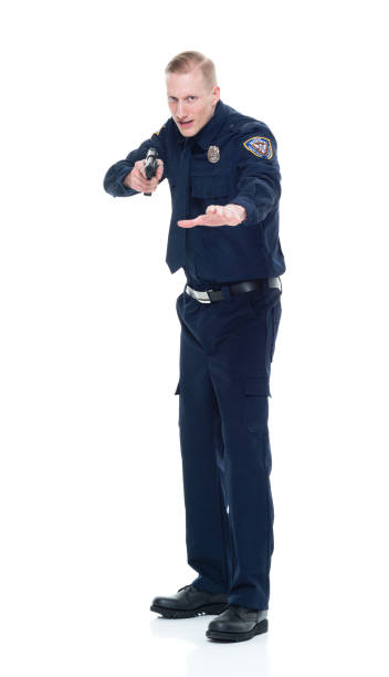 istock Handsome and friendly police officer with handgun and aiming 924639234