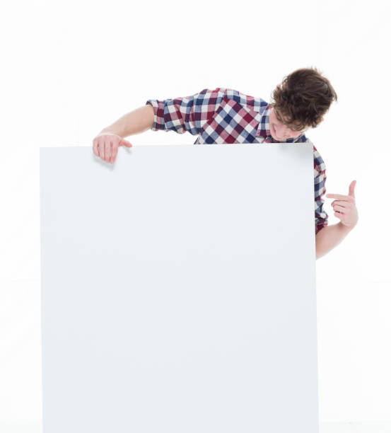istock Trendy young male holding a white sign 924639918