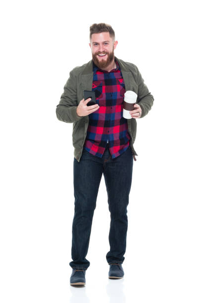 istock Cool guy with jacket and red shirt with phone and coffee 924640264