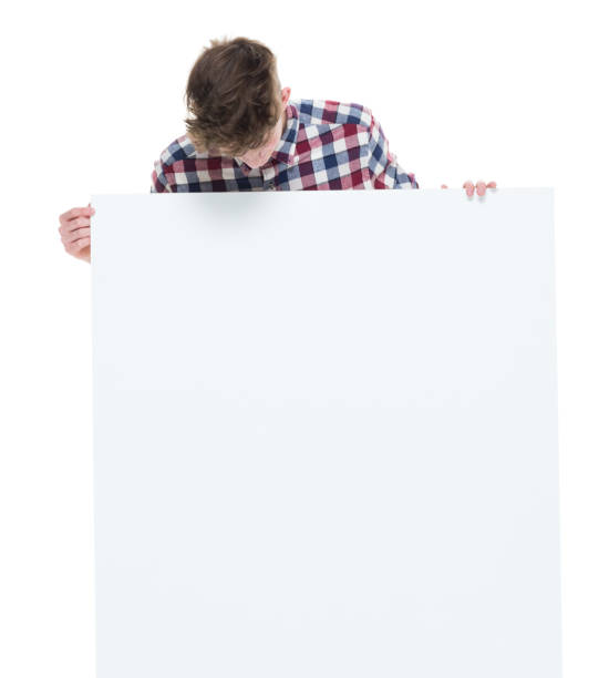istock Trendy young male holding a white sign 924640760