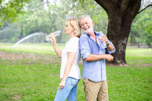 istock Portrait senior couple standing drinking water 924640892