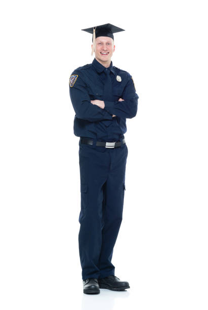 istock Handsome police officer with graduation cap 924641494