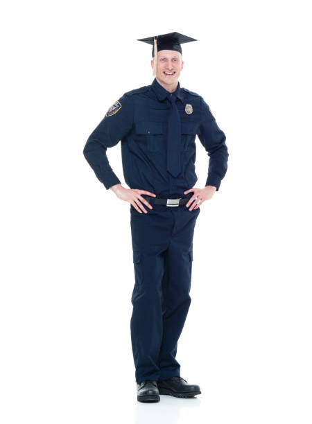 istock Handsome police officer with graduation cap 924641518