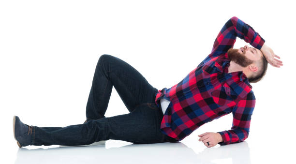 istock Attractive man in plaid shirt lying down 924644942