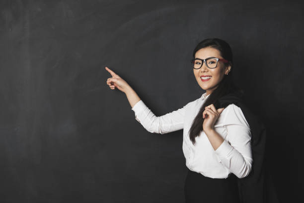 istock Young asian businesswoman on blackboard 924645268