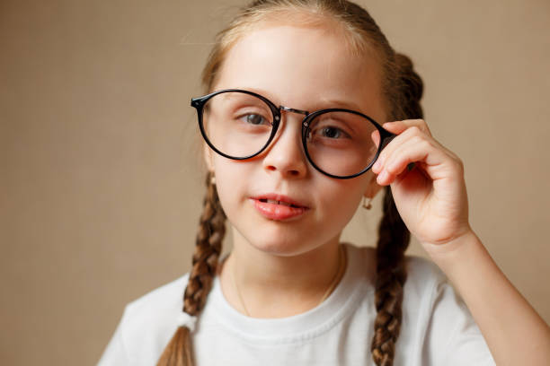 istock little girl with big glasses 924645676
