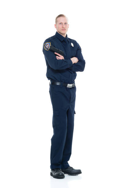istock Handsome and friendly police officer standing with gun 924649112