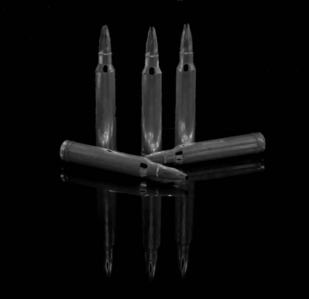 istock An abstract black and white background with five subdued rifle bullets 924649578