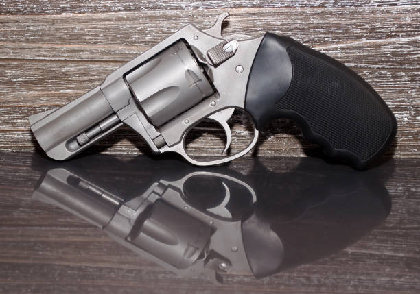 istock A stainless 44spl revolver with a wooden background 924649630