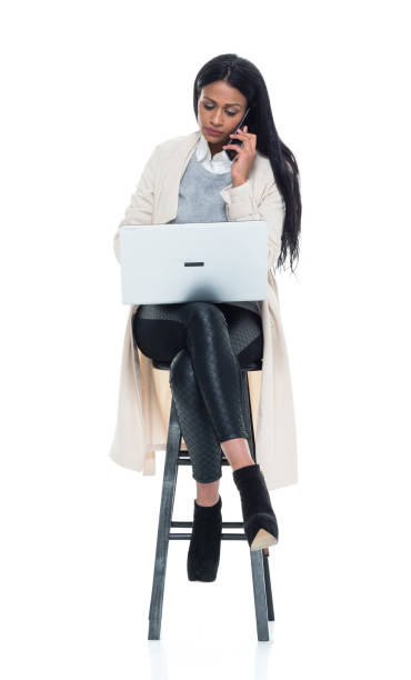 brazilian businesswoman sitting on stool and working - one person people boredom isolated imagens e fotografias de stock