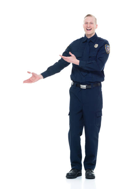 istock Handsome and friendly police officer presenting to the side 924649986