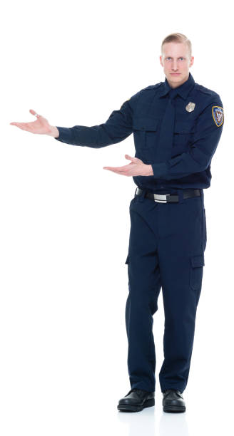istock Handsome and friendly police officer presenting to the side 924649988
