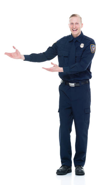istock Handsome and friendly police officer presenting to the side 924652078