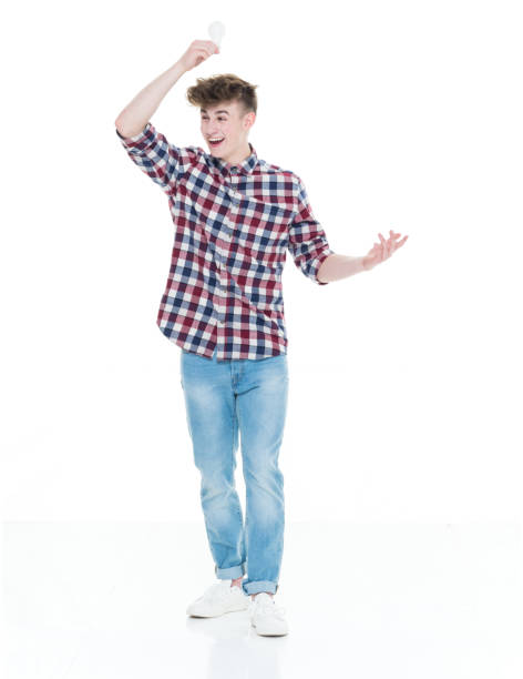 istock Trendy young male holding a lightbulb for idea concept 924652214