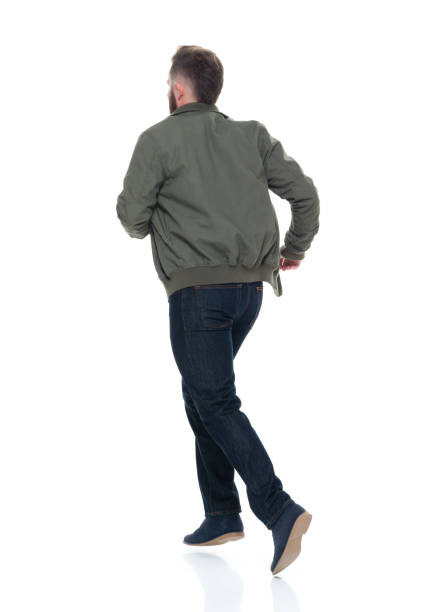 istock Man in bomber jacket and plaid shirt running 924652264