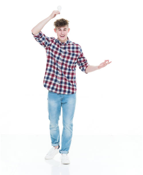 istock Trendy young male holding a lightbulb for idea concept 924652268