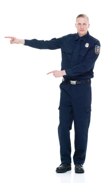 istock Handsome and friendly police officer presenting to the side 924652502