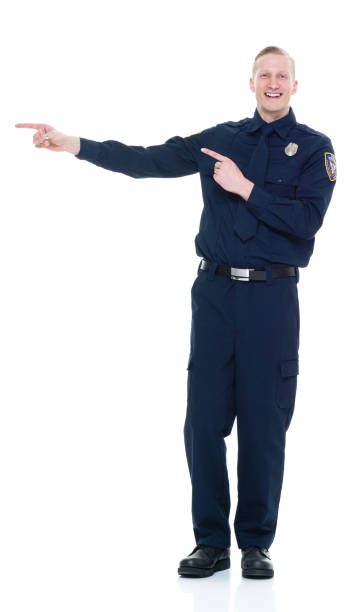 istock Handsome and friendly police officer presenting to the side 924652560