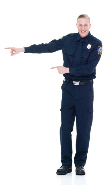 istock Handsome and friendly police officer presenting to the side 924652578