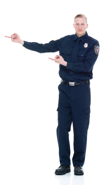 istock Handsome and friendly police officer presenting to the side 924652712