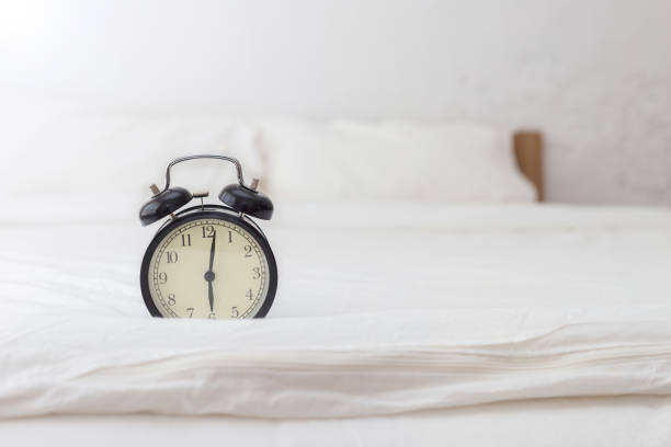 istock Alarm clock in bed room in 6 A.M. 924652760
