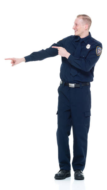 istock Handsome and friendly police officer presenting to the side 924655360