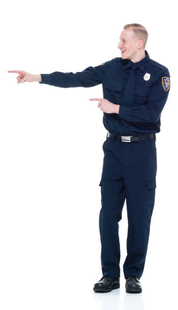 istock Handsome and friendly police officer presenting to the side 924655528