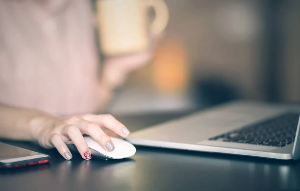 istock Close up of  woman hand serching and click mouse using laptop 924660060