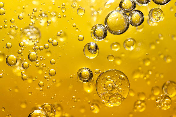 istock golden yellow bubble oil, abstract background 924663622