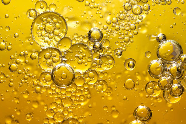 istock golden yellow bubble oil, abstract background 924663632