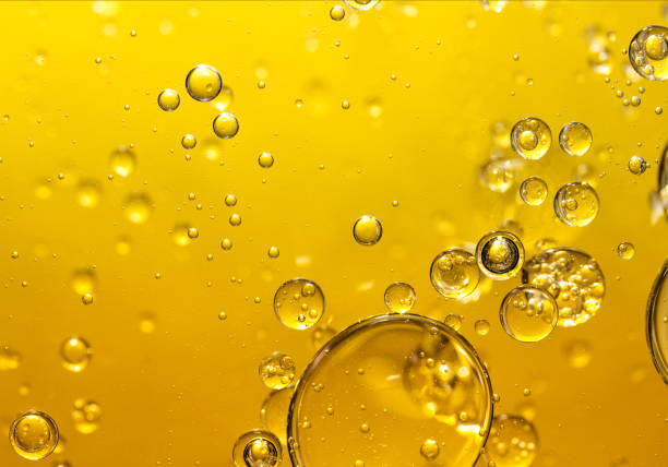 istock golden yellow bubble oil, abstract background 924663970