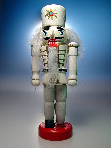 Christmas Nutckracker, White Semi-isolated, rustic, antique Christmas nutcracker doll.   nutcracker photos stock pictures, royalty-free photos & images