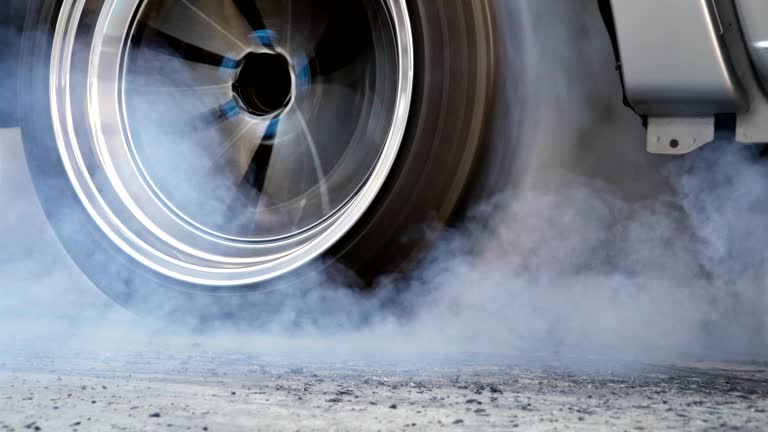 Drag racing car burn tire at start line