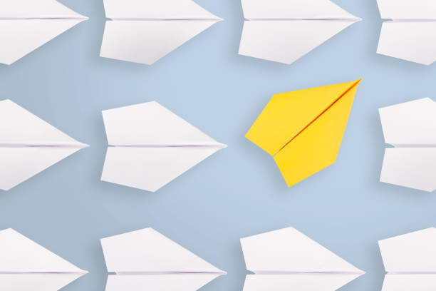 Change concepts with yellow paper airplane Change concepts with yellow paper airplane paper airplane photos stock pictures, royalty-free photos & images