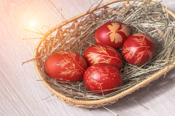 istock Easter eggs laying in wicker wooden basket 924673758