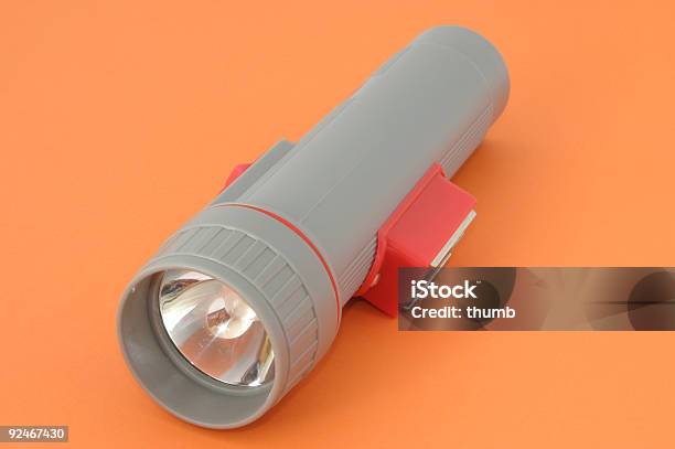 Flashlight On Orange Stock Photo - Download Image Now - Flashlight, Camping, Cut Out