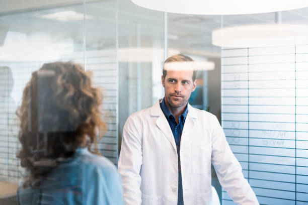 istock Confident doctor discussing with female colleague 924677066