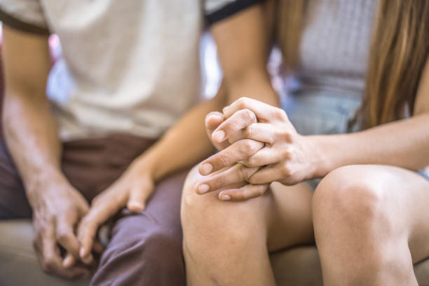 istock Midsection of loving young couple holding hands 924677700