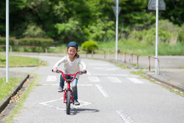 istock Little girl riding a bicycle 924684818