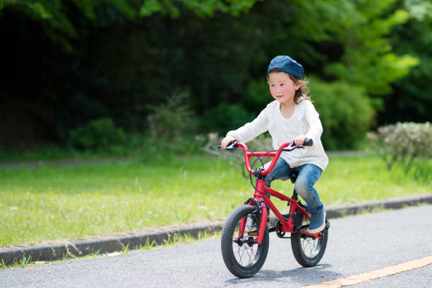 istock Little girl riding a bicycle 924684852