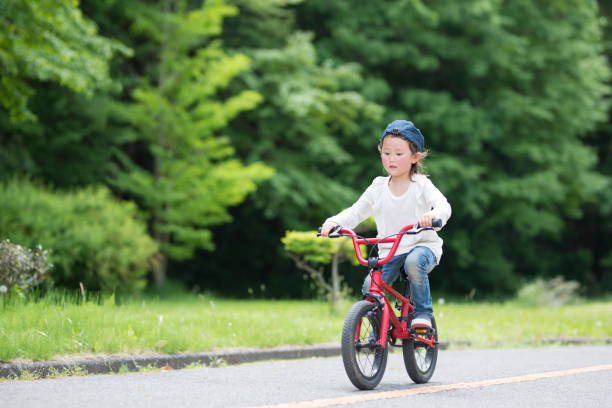 istock Little girl riding a bicycle 924684896