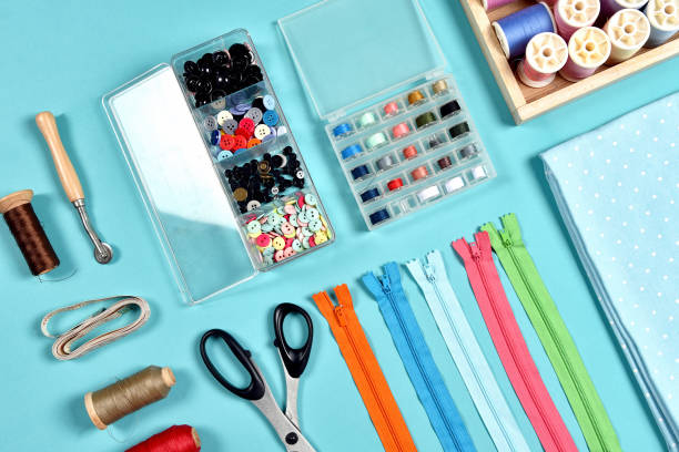 istock Pastel color background, Dressmaker and designer desk, Handcraft accessories, Threads roll, scissors, zip, button 924685204